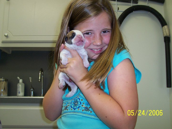 A child holding a puppy